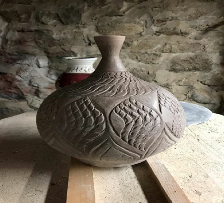hand carved bottle, wheel thrown  created by local artist  John Kondra